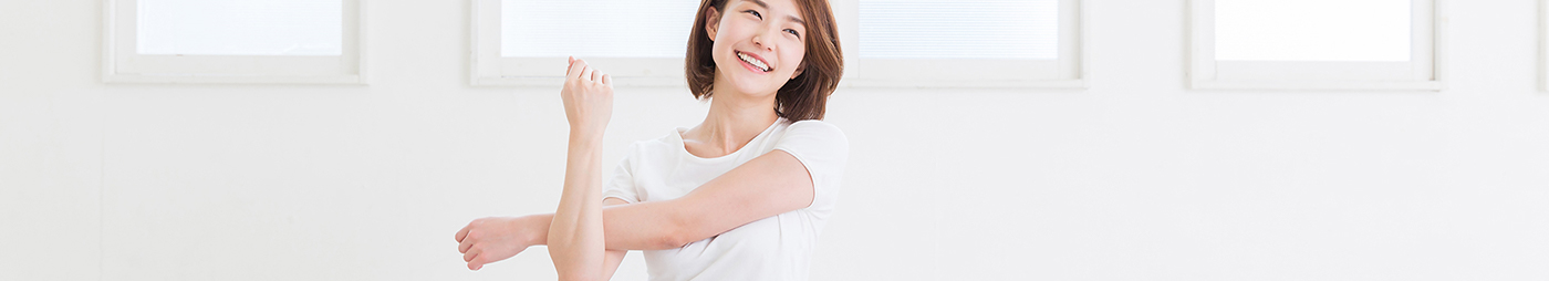 smiling woman stretching arms