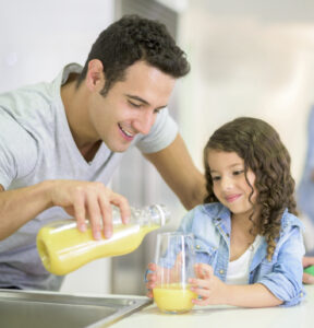 Man Having Breakfast With His Daughter
